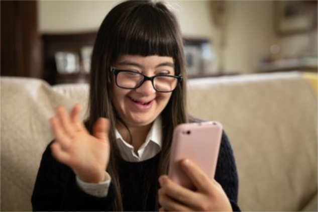 a young woman with Down syndrome uses a smartphone