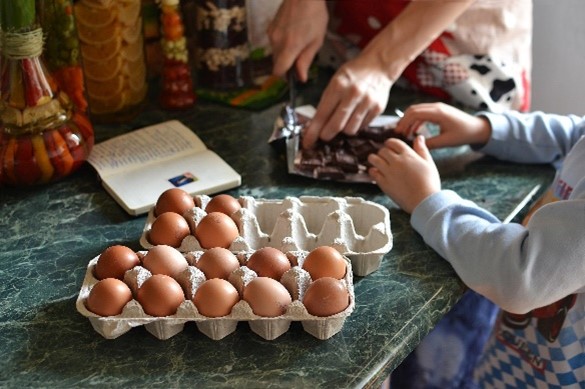 two people prepare a recipe together